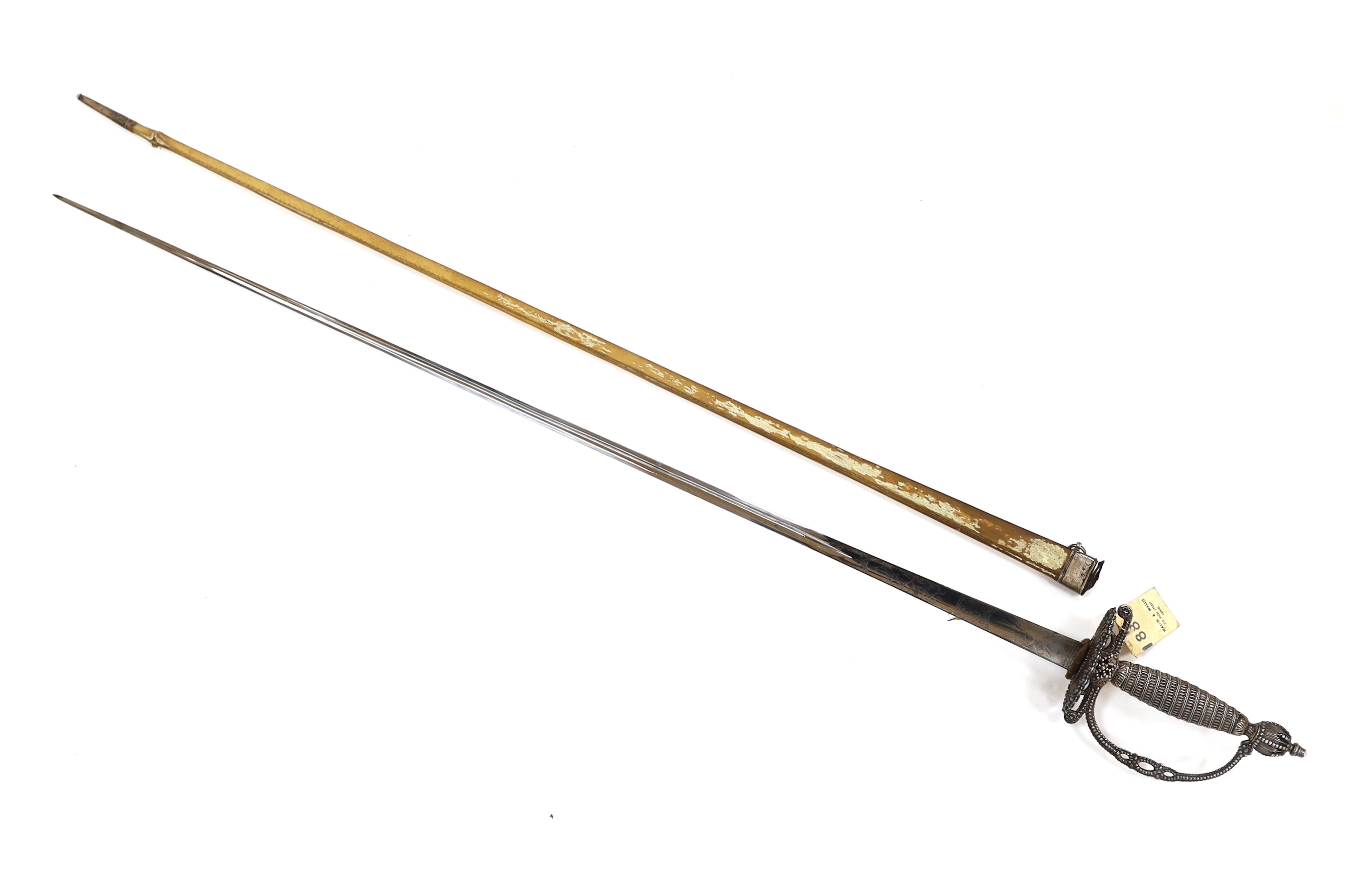 An English small sword, c.1775, pierced with facetted stud work, silver tape and wire bound grip, triangular section etched blade, in its original vellum scabbard and silver mounts, top mount engraved Dieltry Royal Excha
